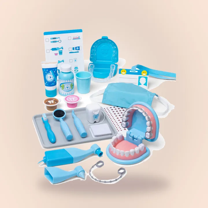 Red dentist play set with toy teeth and tools