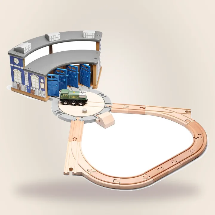Wooden train roundhouse with tracks and engine