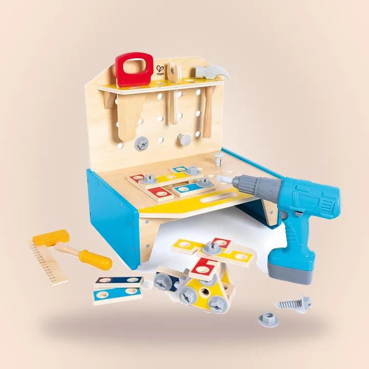 Wooden workbench toy with colorful building pieces