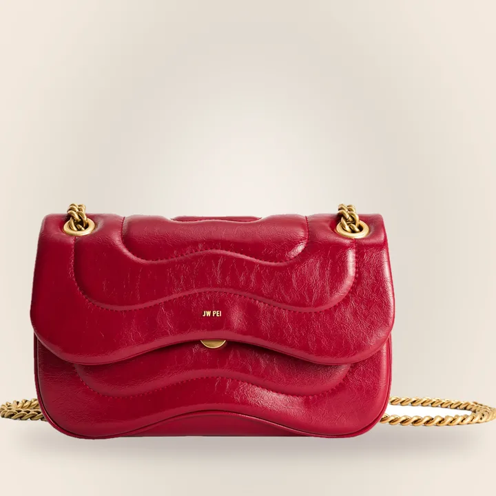 Quilted claret crossbody bag with a chain strap