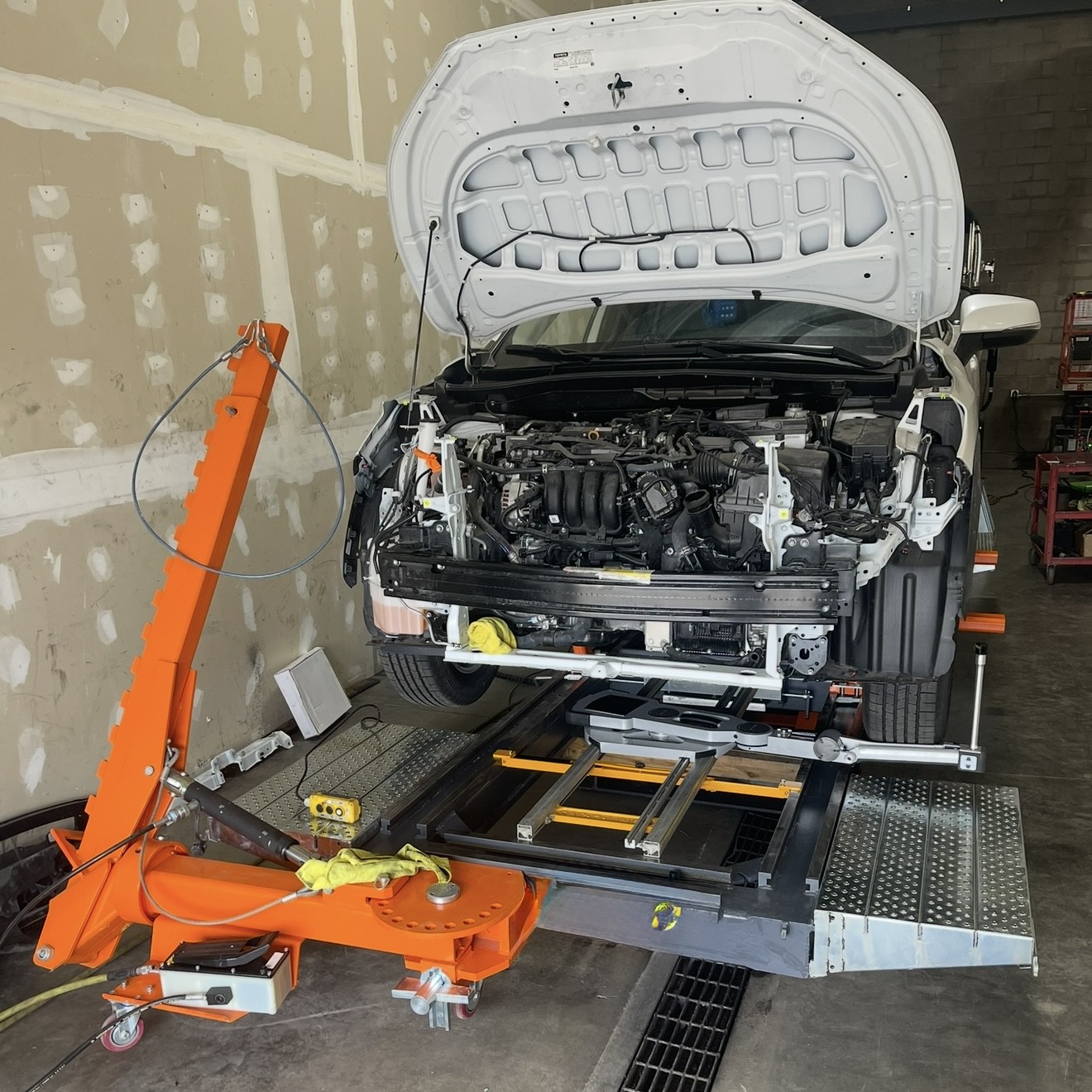 Technician Repairing Frame on frame rack frame repair