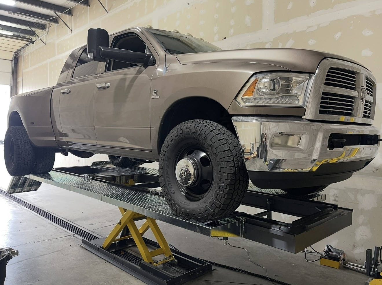 Technician Repairing Frame on frame rack frame repair truck