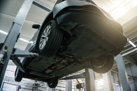 Technician Repairing Frame on frame rack frame repair lift