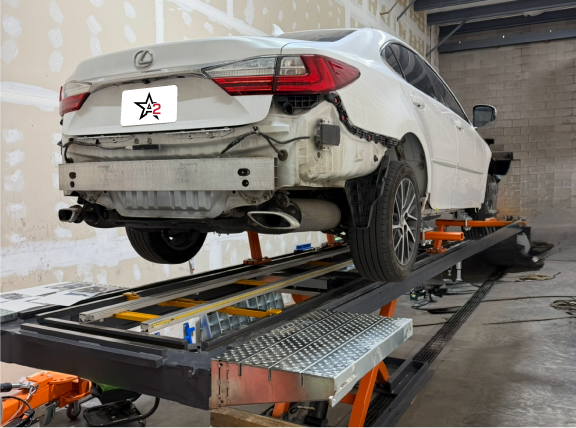 Technician Repairing Frame on frame rack frame repair rack
