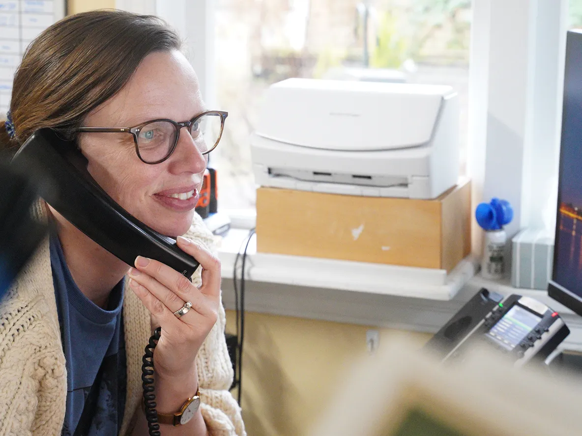A staff member working in the Support Center.