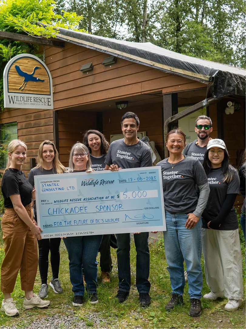 Our team being presented with a cheque from a corporate sponsor.