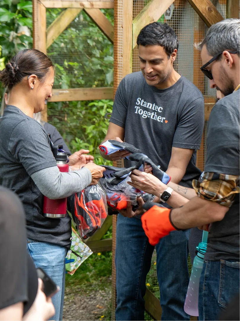 A corporate sponsor getting hands on experience with a rescue.