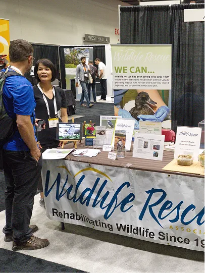 A member of the public visiting our table at a community event.