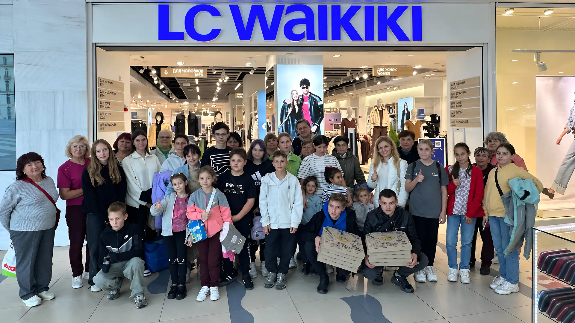 Children and adults after shopping together at an LC Waikiki store