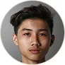 Portrait of a young Asian man with short black hair against a neutral background.