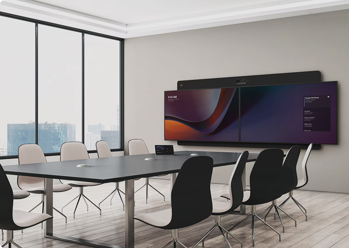 Modern meeting room featuring a wall-mounted display and integrated conferencing equipment.