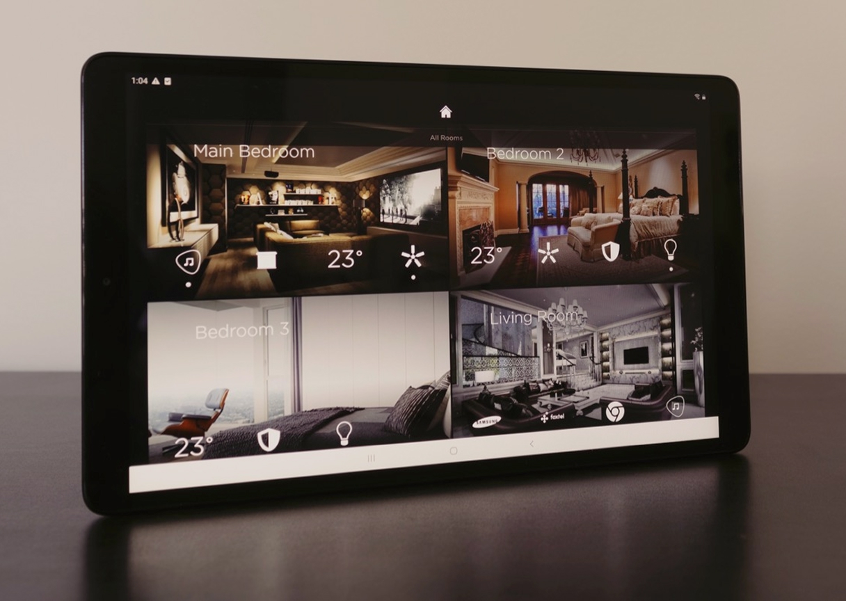 Smart-home tablet displaying air-quality, humidity, and temperature control across home zones.