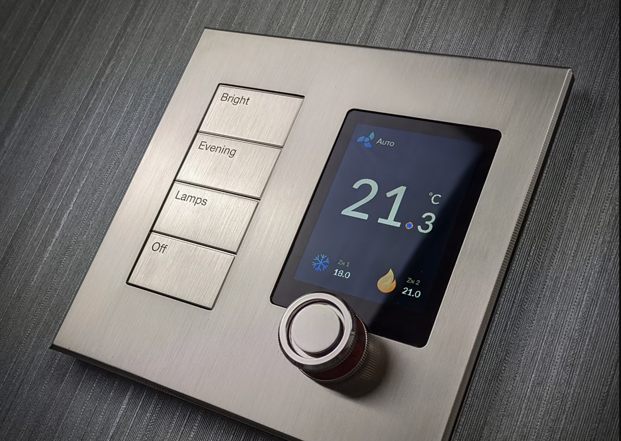 Wall-mounted smart thermostat showing temperature and climate settings for home comfort.