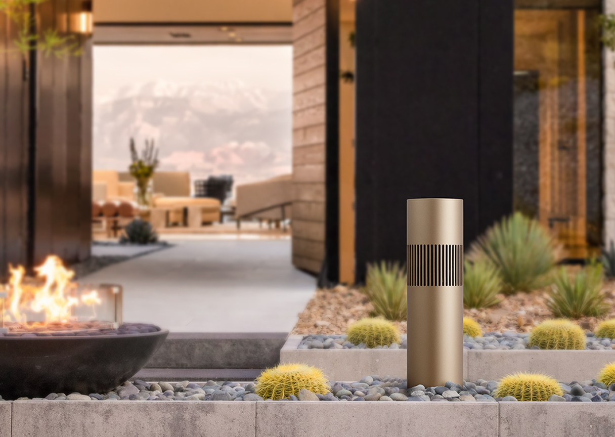 Weatherproof garden light beside outdoor fire pit, demonstrating durable exterior lighting design by TR Electronics.