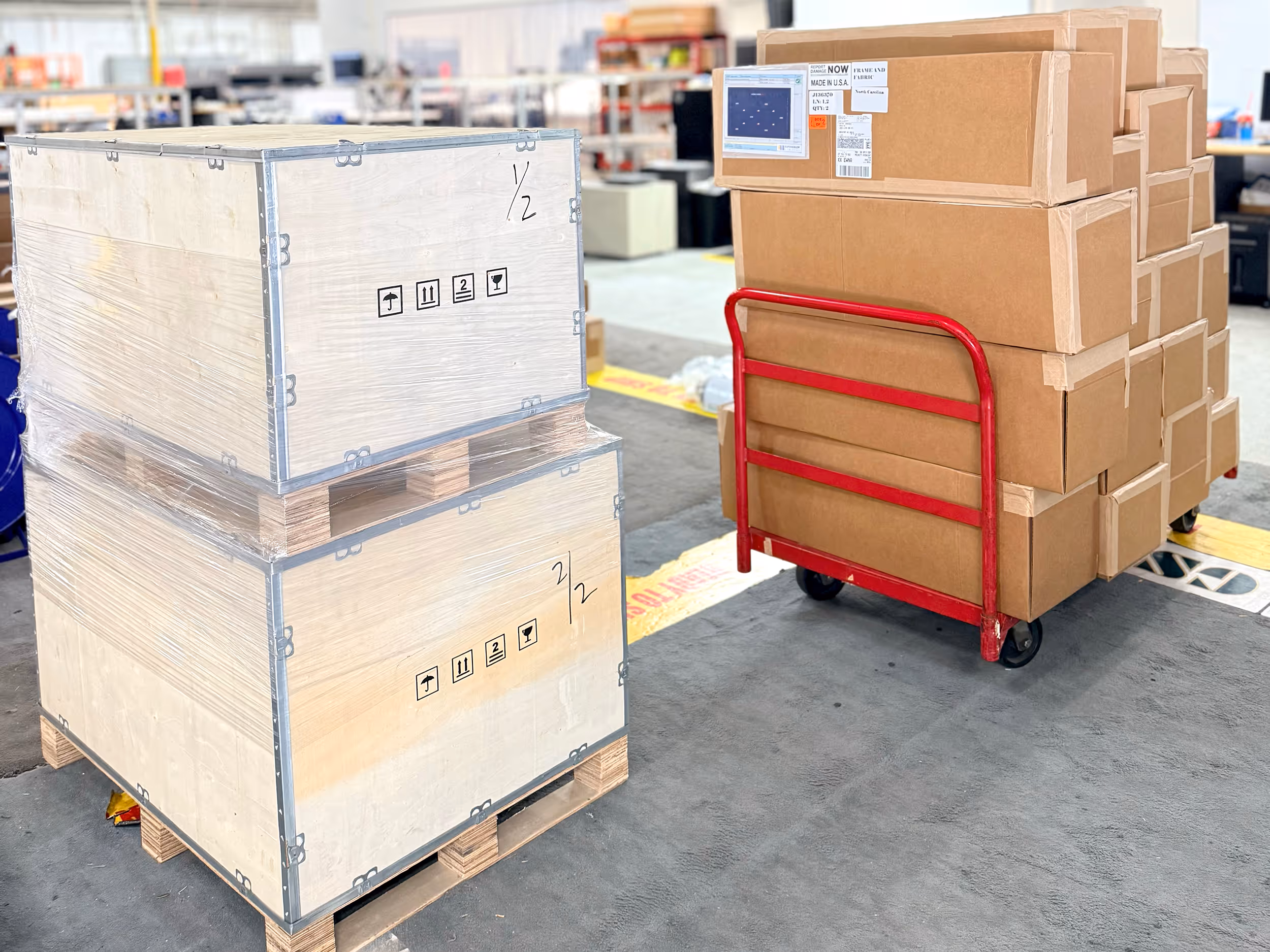 Packsize EMS-35 on demand packaging machine in a warehouse with cardboard pieces on a wooden table.