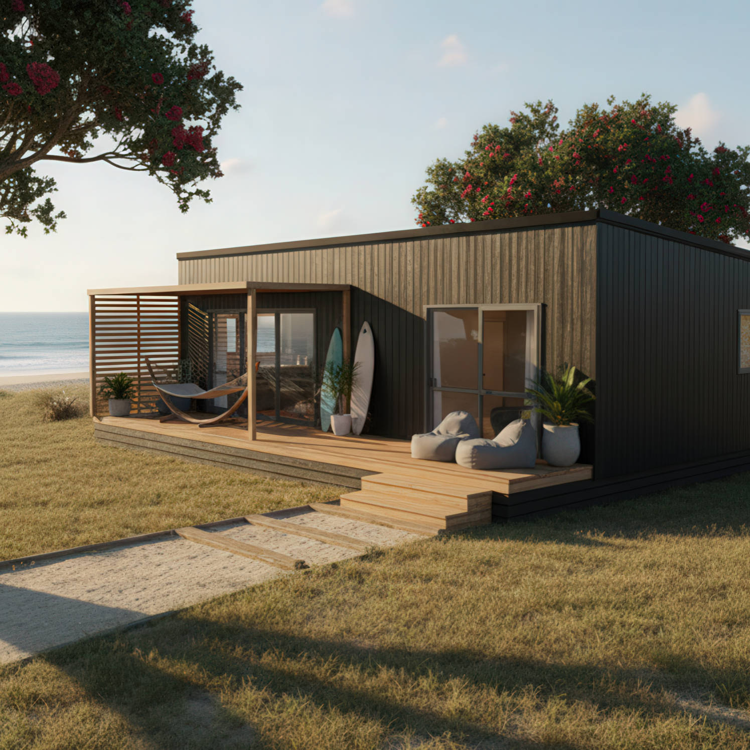 Modern beach house with wooden deck, lounge chairs, hammock, surfboards, and potted plants overlooking the ocean.