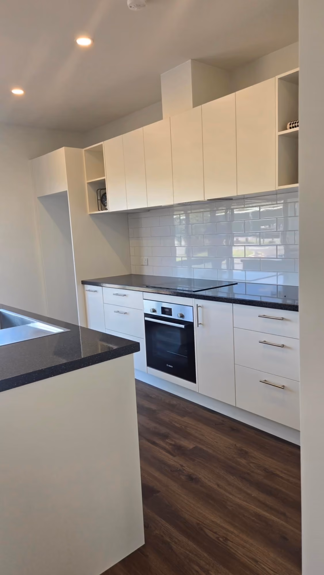 Nest 70 Double ex-stock kitchen with Bosch oven, induction cooktop and subway tile splashback