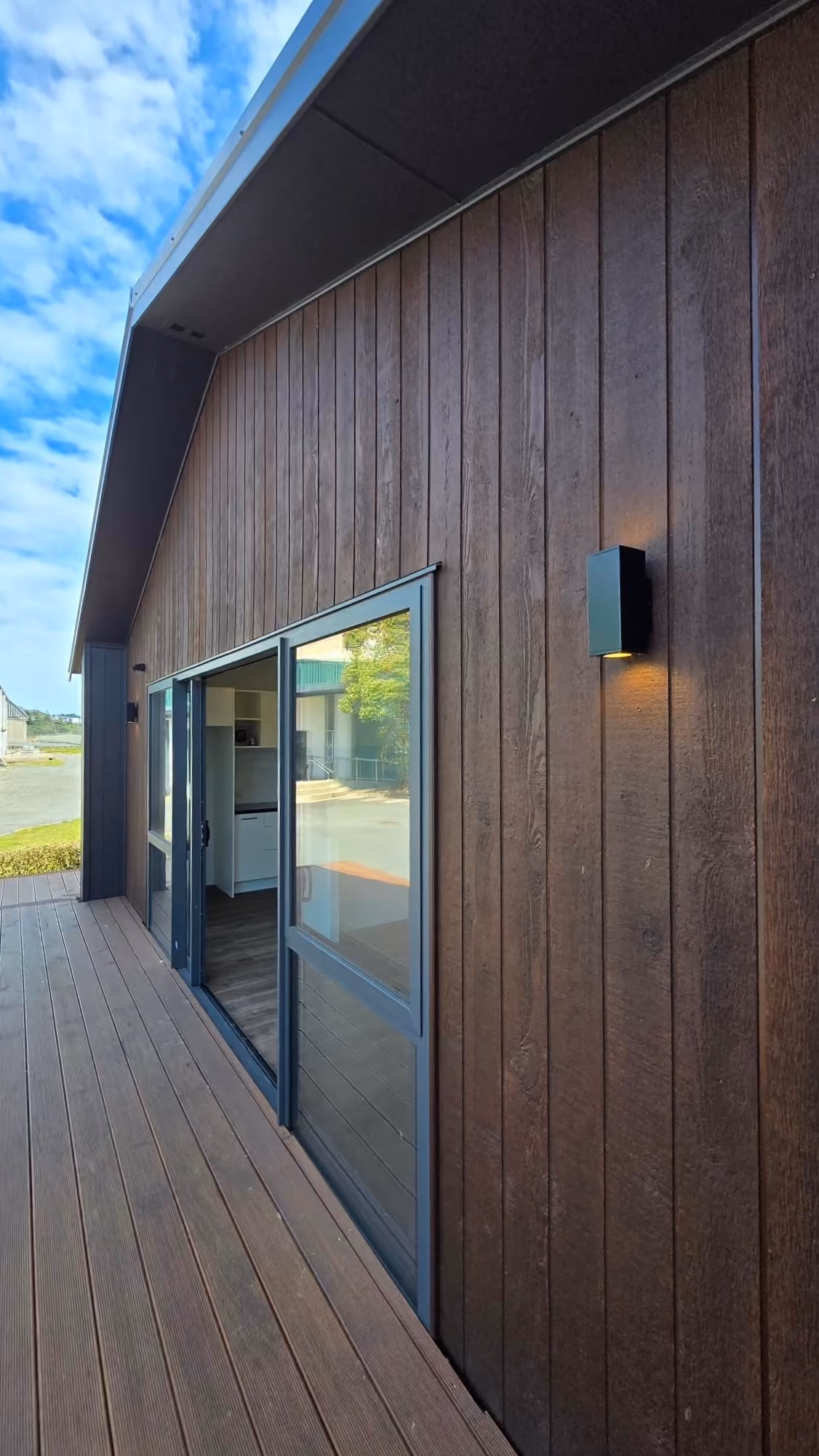Nest 70 Double ex-stock vertical timber cladding, exterior lighting and deck