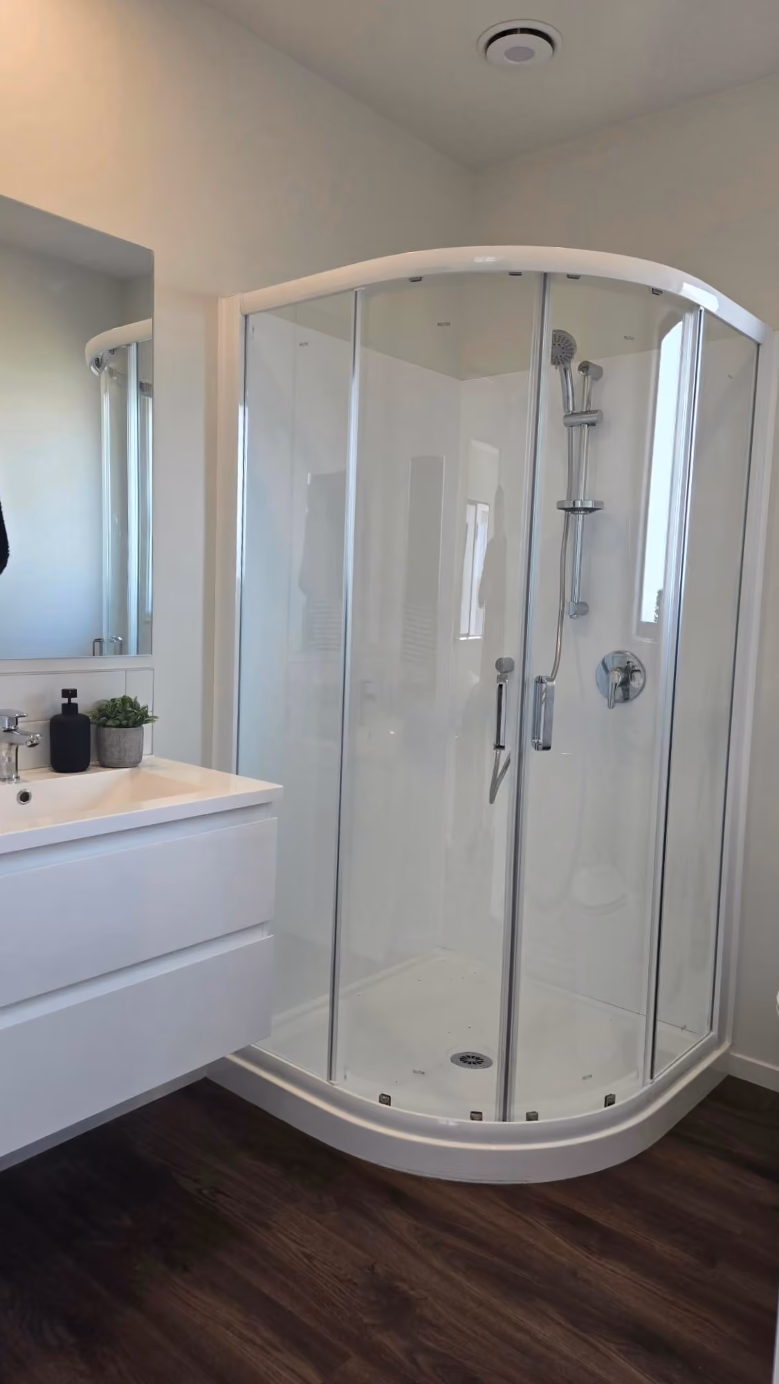 Nest 70 Double ex-stock bathroom with curved shower and wall-hung vanity