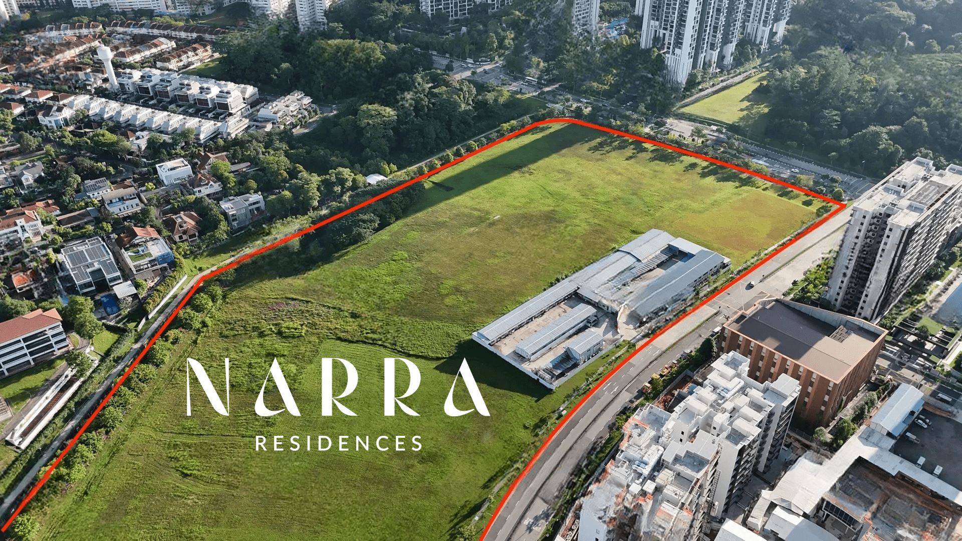 Aerial view of a large green open field outlined in red, labeled Narra Residences, surrounded by residential buildings and trees.