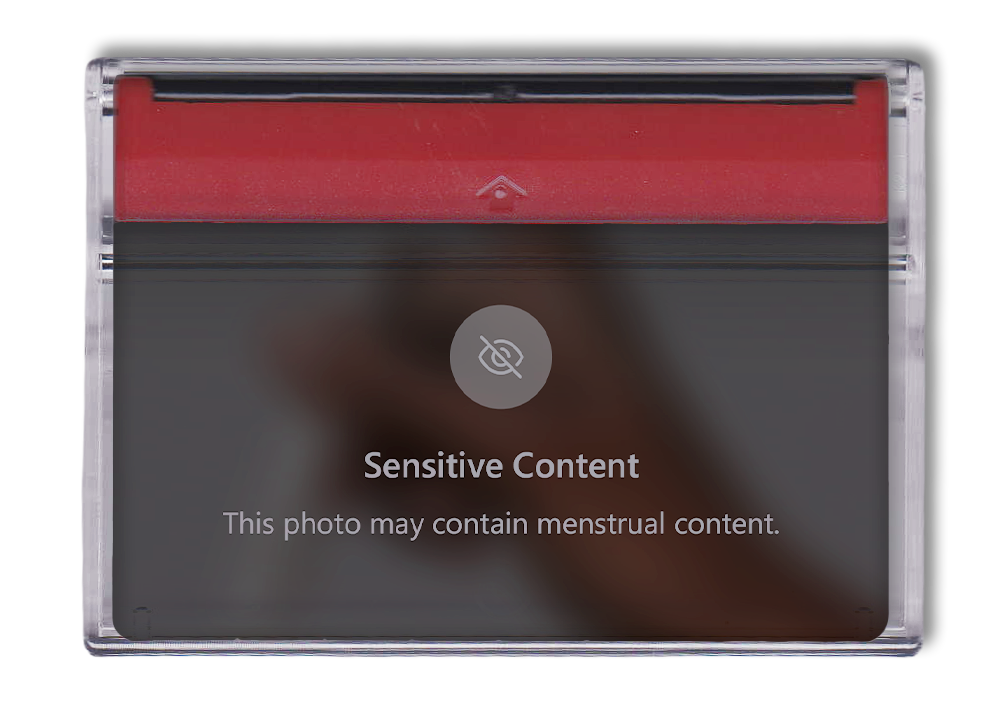Retro clear cassette tape with red top containing image of 'Sensitive Content' warning about women's health.