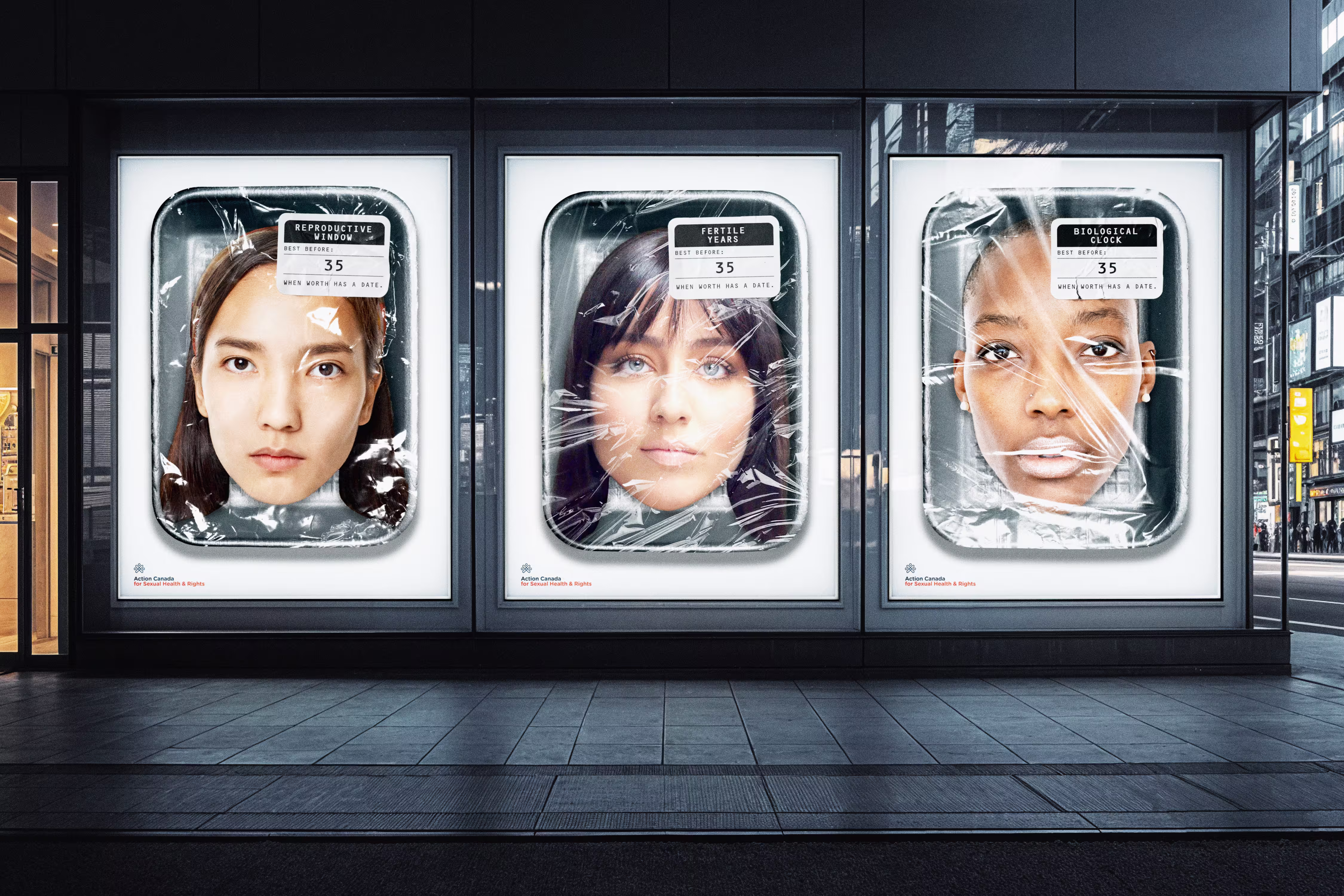 Three large posters of women's faces wrapped in plastic, each labeled with 'Best Before: 35' and terms Reproductive Window, Fertile Years, and Biological Clock.