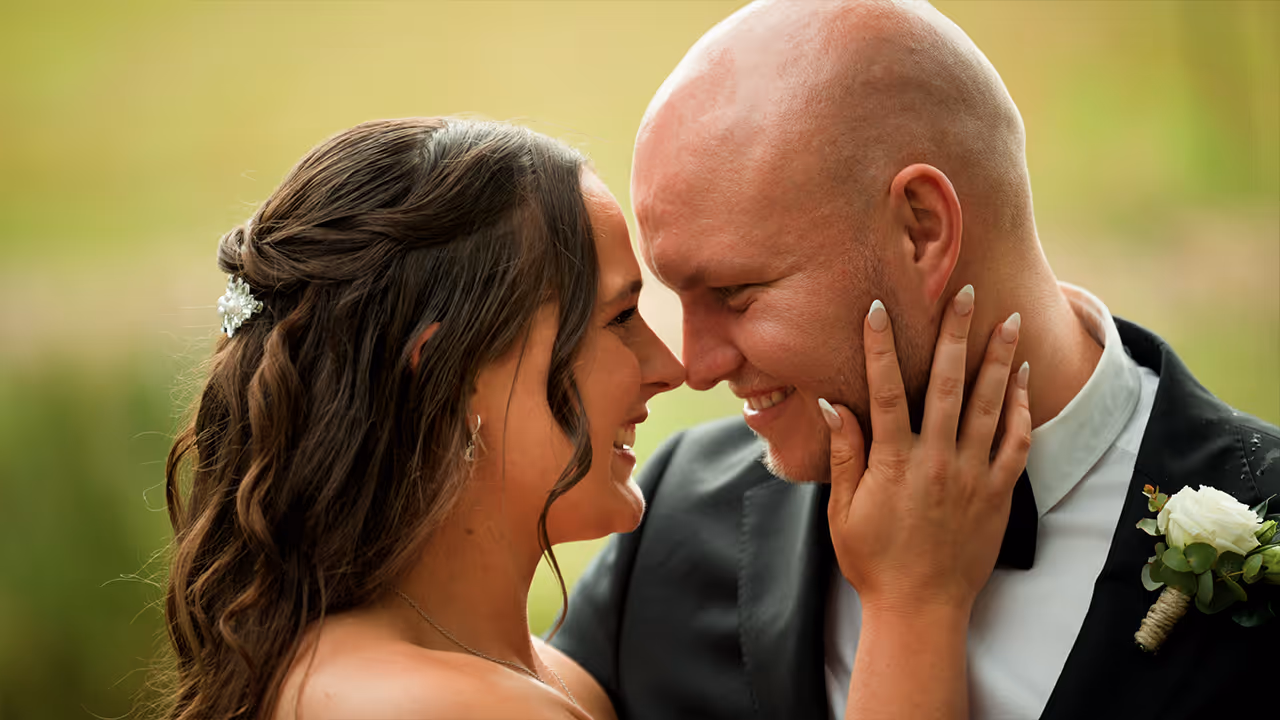Bride and groom share a close, joyful moment together, captured in soft natural light by Creo Bella.