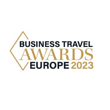 Logo for the Business Travel Awards Europe 2023, featuring gold and black text with a geometric design.
