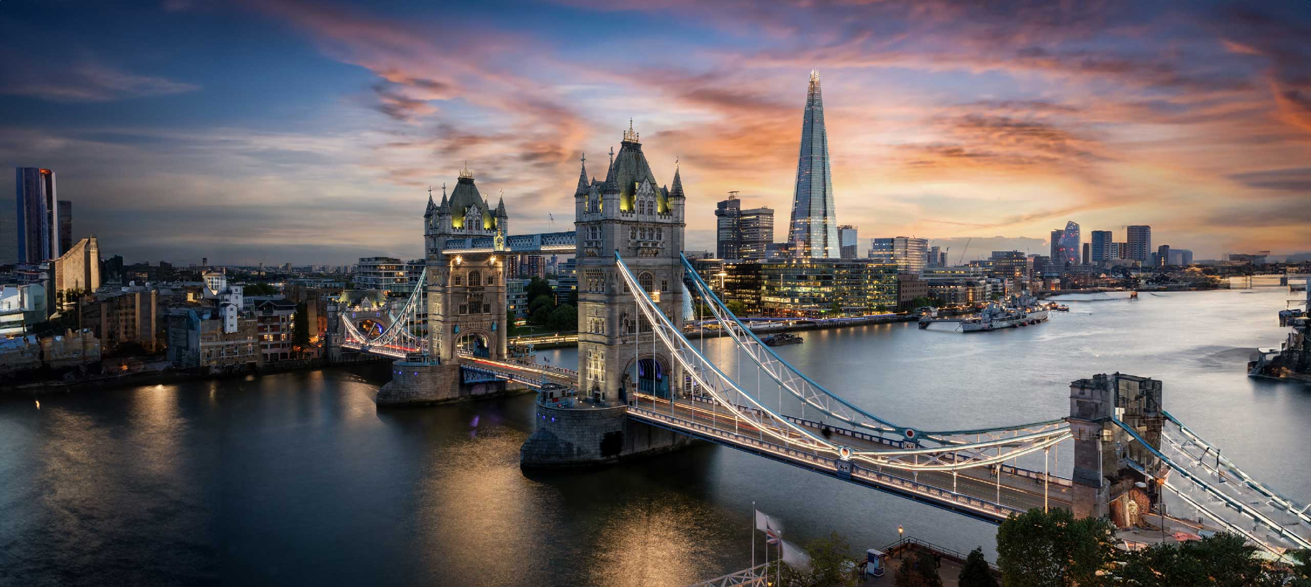 Tower Bridge and The Shard at sunset, overlooking the Thames in London.