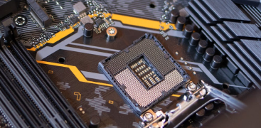 A close-up of a CPU socket on a motherboard, showcasing pins and circuit details.