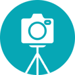 A white camera on a tripod icon inside a teal circle, symbolizing photography or media.
