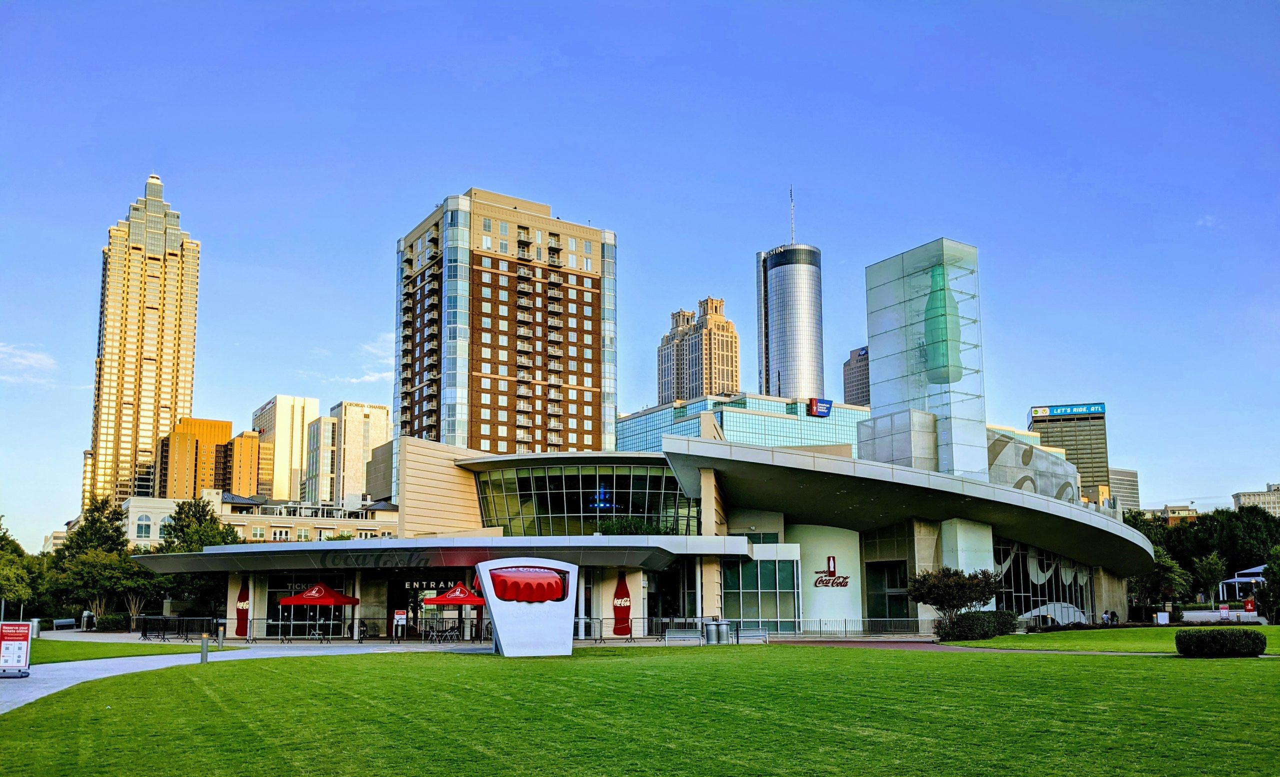 The World of Coca-Cola in Atlanta, with modern skyscrapers towering in the background.