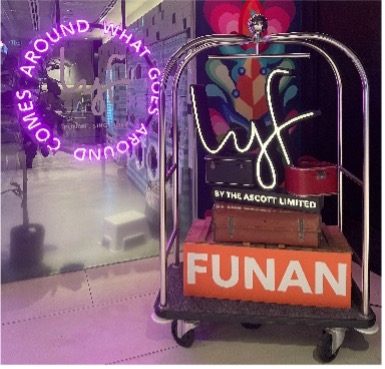 A luggage cart with neon