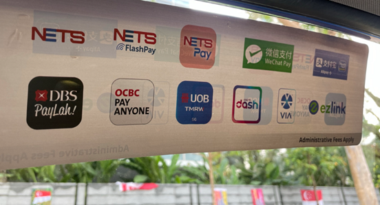 Payment options sticker displaying various digital payment methods accepted in Singapore taxis.