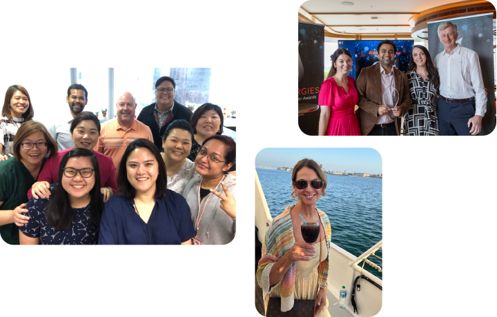 Groups of people gather indoors and outdoors, with one holding a glass of wine near the water.