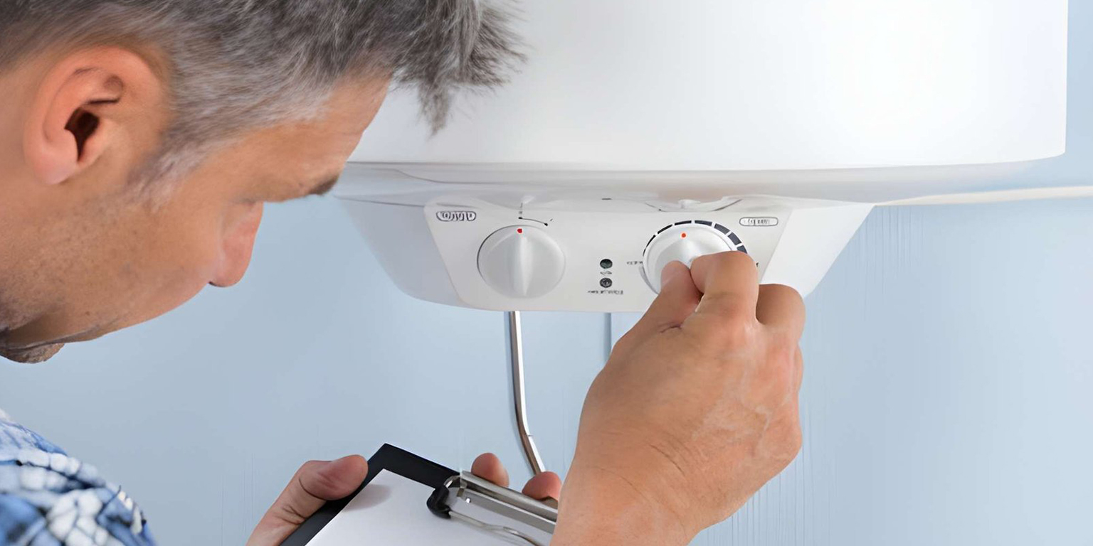 Technician diagnosing an electric water heater not heating in a Dubai apartment