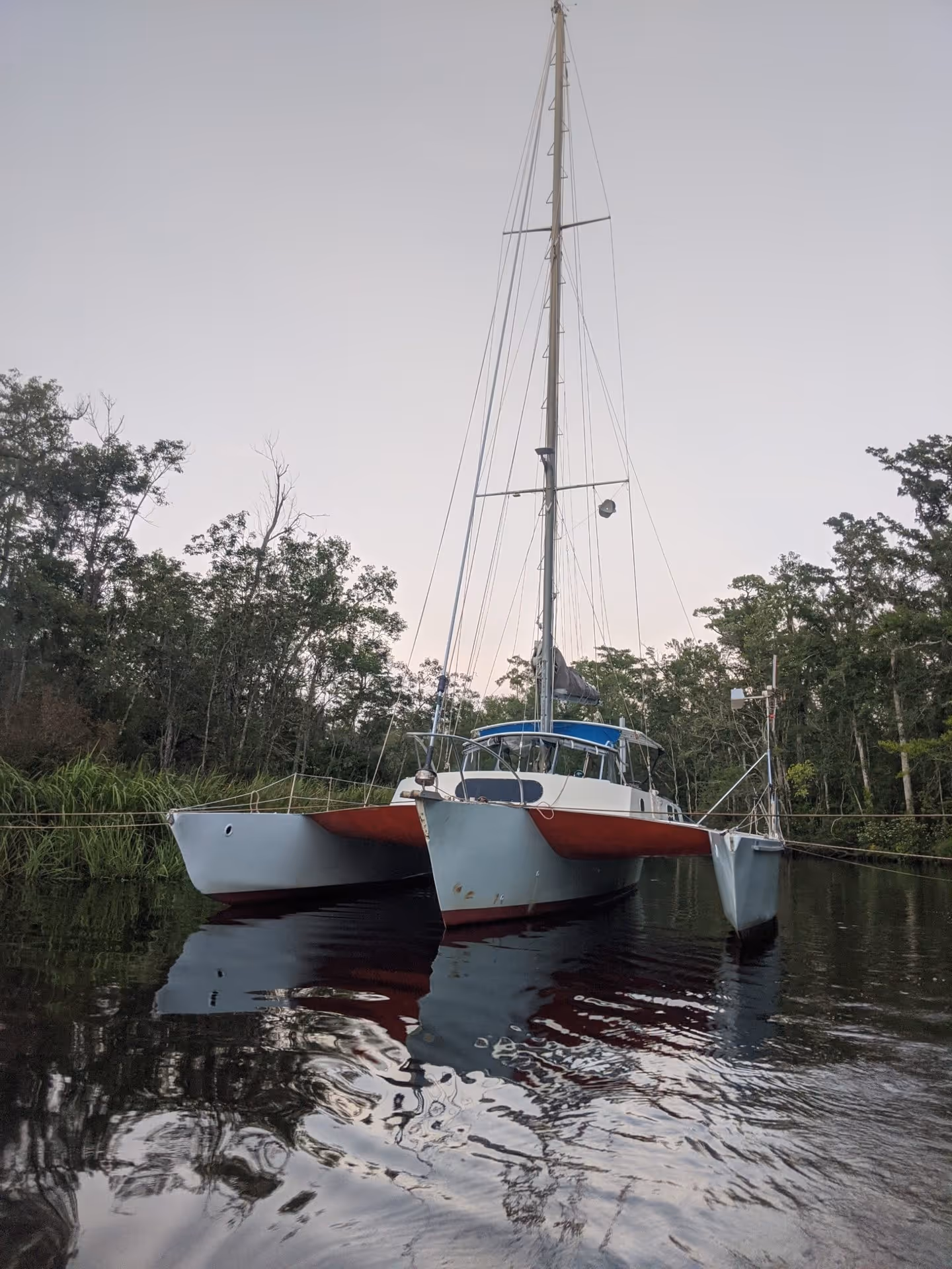 moored catamaran prepped for a hurricane