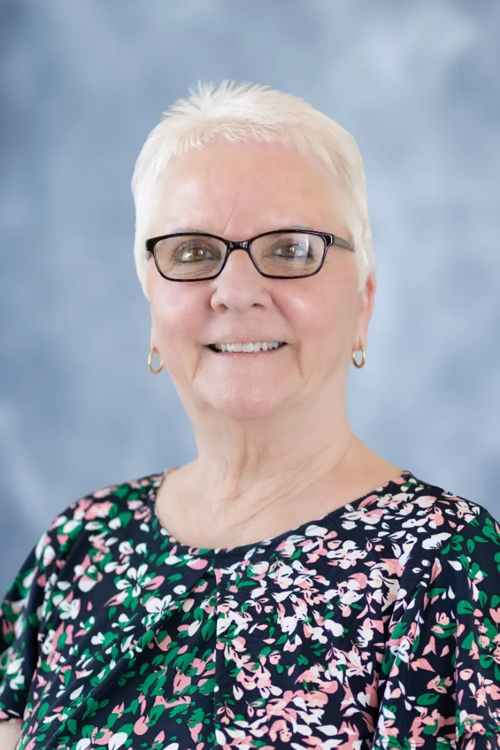 A portrait photograph of Judi Brown