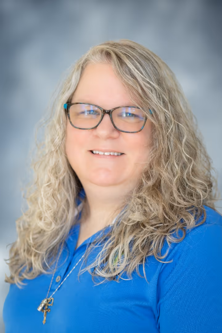 A portrait photograph of Chrissy Stone