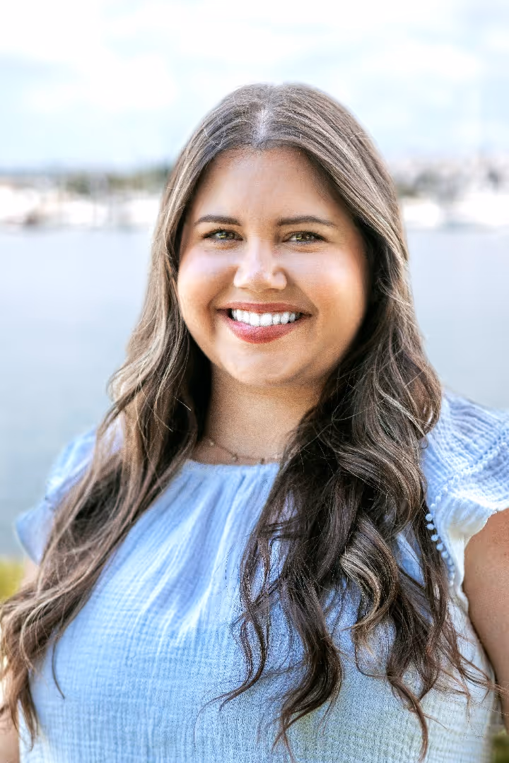 A portrait photograph of Ashley Carroll