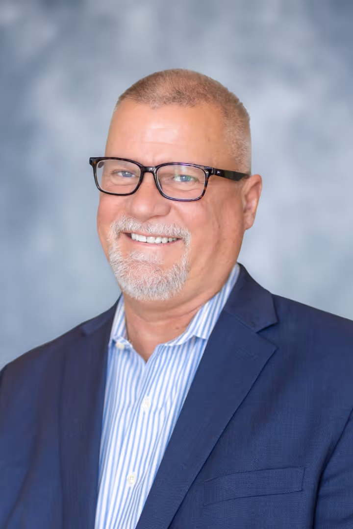 A portrait photograph of Steve Cooper