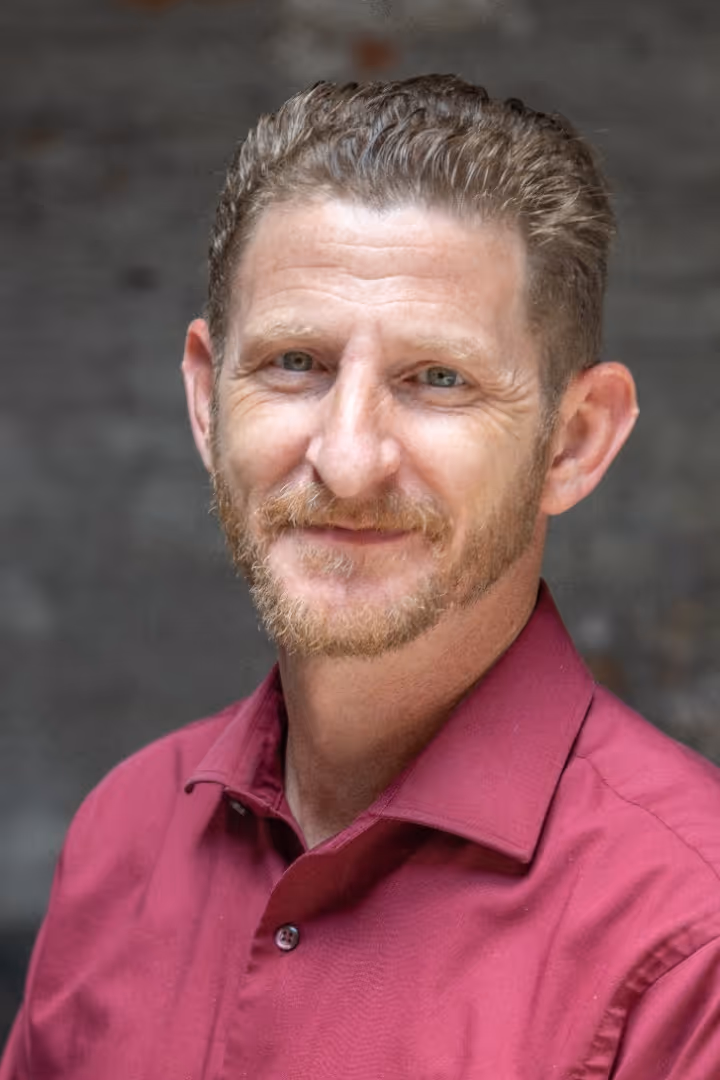 A portrait photograph of Seam Clarke