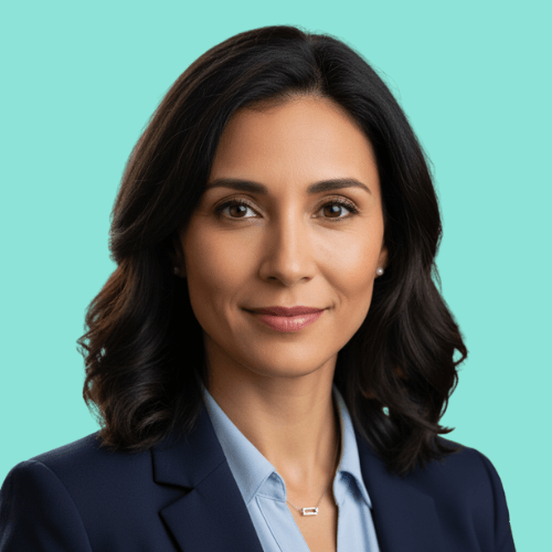 Professional woman with dark wavy hair wearing a navy blazer and light blue shirt against a turquoise background.