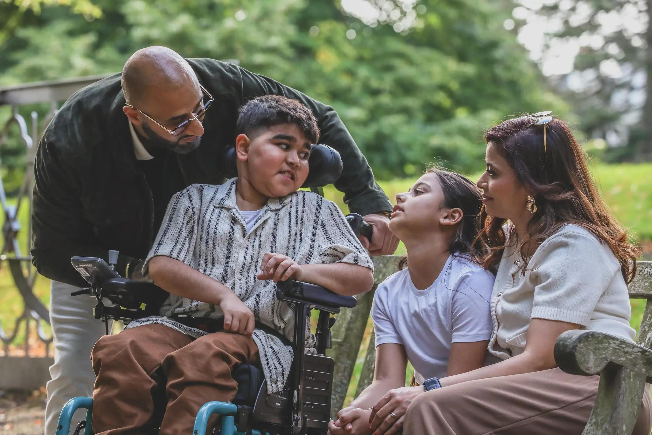 Family spending time together outdoors in a sunny park