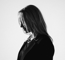 An image of a female model looking to the left.