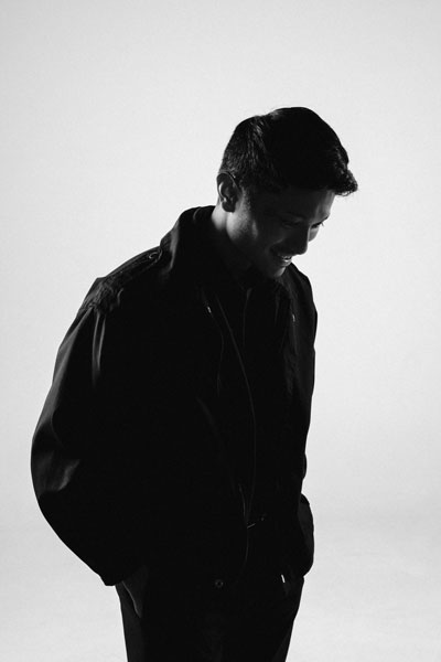 A photo of Roi Toledo in editorial style looking down. He is the Latest's Executive partner. Leading brand and website departments.