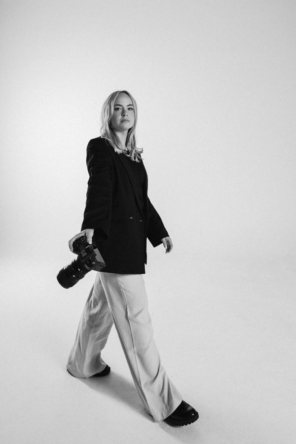 A photo of a The Latest staff with her camera to show "how we work."