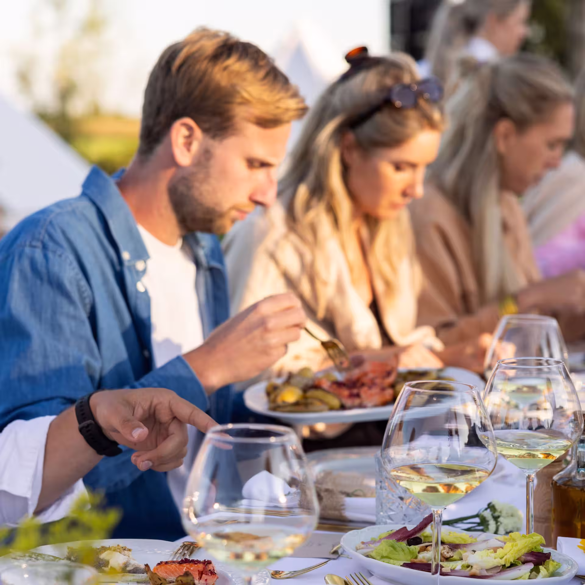 a group of friends enjoying a summer feast