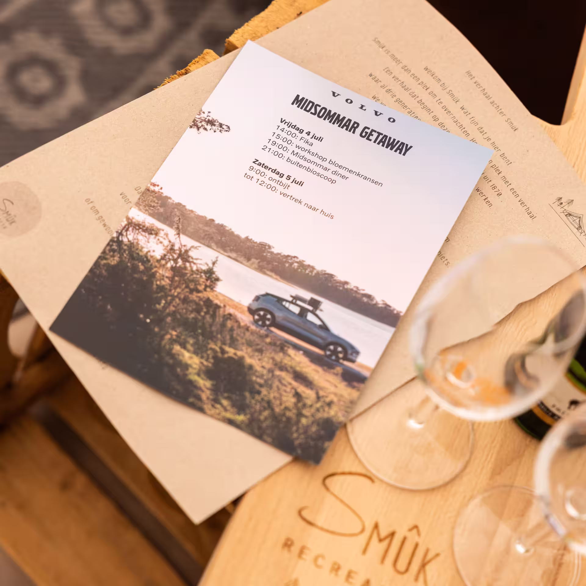a volvo brochure sitting on a wooden table