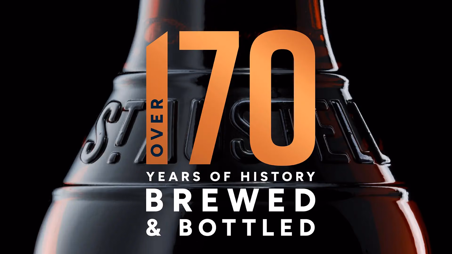 A beer bottle labeled "70 years of history brewed and bottled," showcasing its heritage and craftsmanship.
